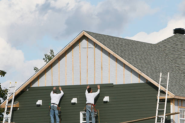 Professional Siding Installation technician working in Burgess, VA